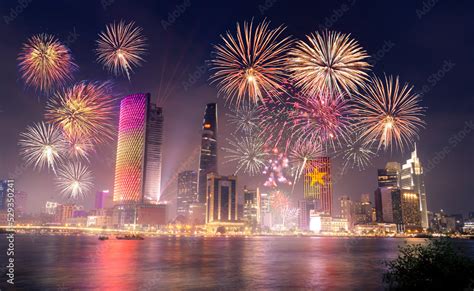 Celebration. Skyline with fireworks light up sky over business district ...