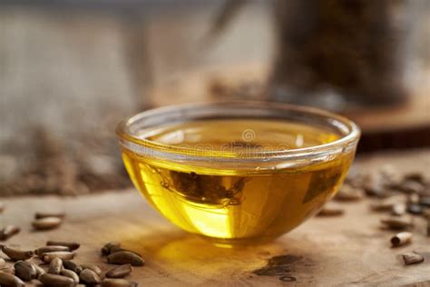 Milk Thistle Oil in a Glass Bowl with Carduus Marianus Seeds Stock Image - Image of close, glass ...