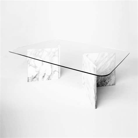 Beautiful and classic Carrara marble coffee table with curved edges clear glass top. The marble ...