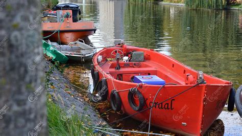 Amsterdam canal view a cute red boat | Content Browser