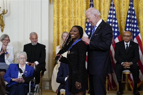 Biden awards Medal of Freedom to Biles, McCain, Giffords | AP News