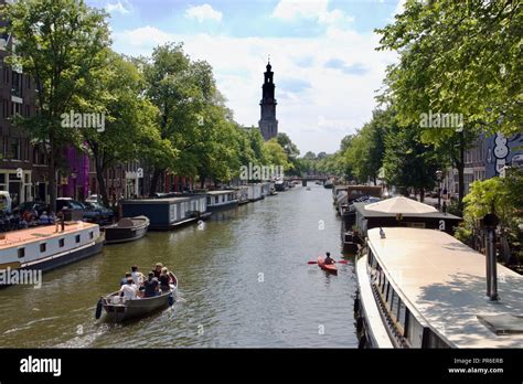 Three different types of boats: Motor boat, canal house boat and kayak ...