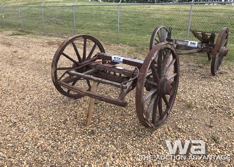 WOODEN WAGON AXLE WITH STEEL WHEELS