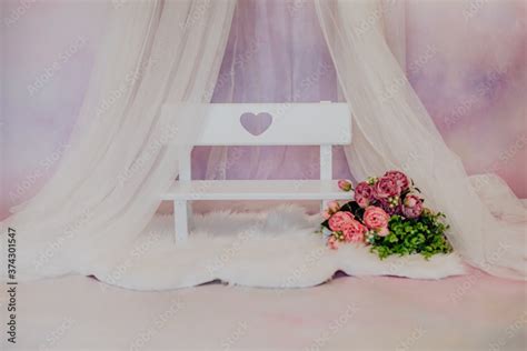 mini baby bench with pink flowers in a photo studio Stock Photo | Adobe ...