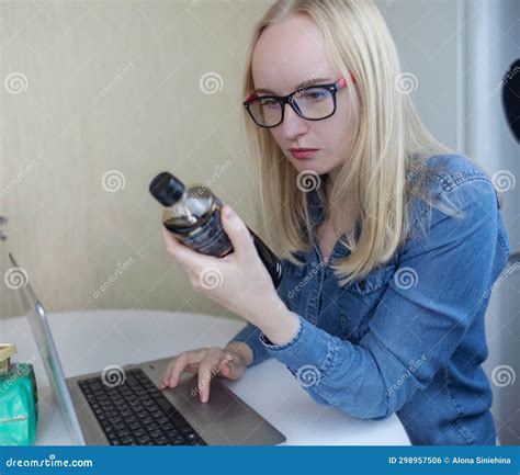 Woman Reads Instructions for Food Products at Home. Checking Labels on Goods. Study of Product ...