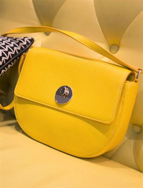 Meet your favorite new crossbody. A leather yellow saddle bag is perfect for day or night ...