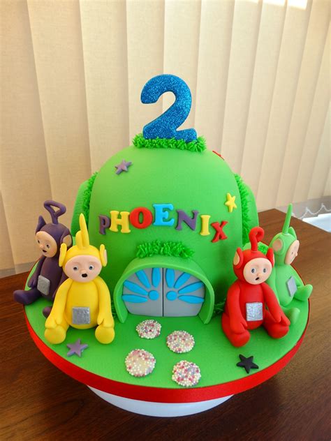 a birthday cake for two year old with fondant decorations