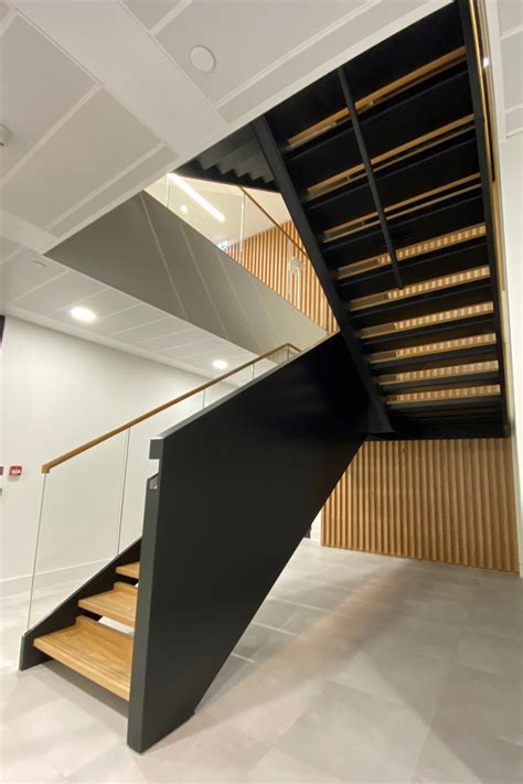 Dog leg office staircase for fit out project | Staircase wall design ...