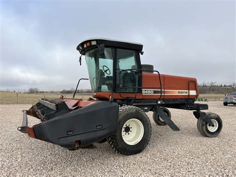 ’99 Hesston 8450 Windrower w/8020 14′ Sickle Header. $20,000 - American Ag Video Auction