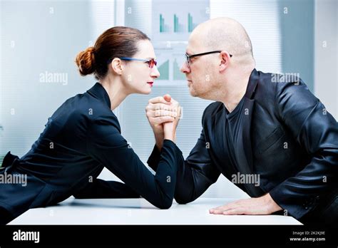 arm wrestling woman VS man Stock Photo - Alamy