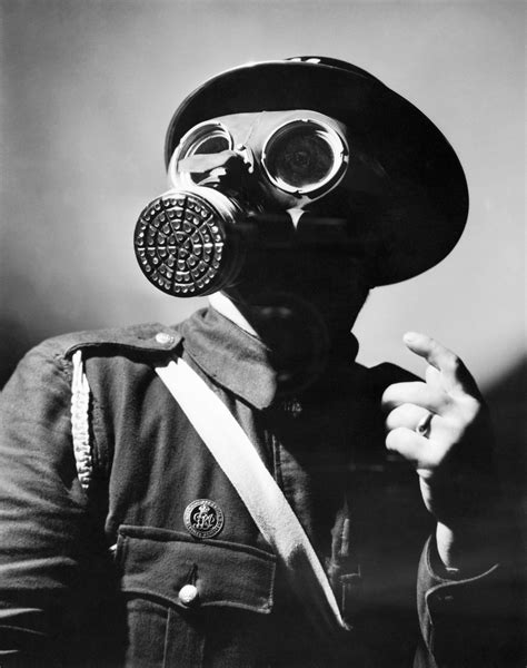 File:An Air Raid Warden wearing his steel helmet and duty gas mask during the Second World War ...