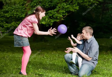 Family Playing In The Park. — Stock Photo © magicinfoto #4861839