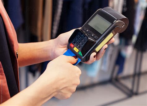 "Woman Making Credit Card Transaction." by Stocksy Contributor "W2 Photography" - Stocksy