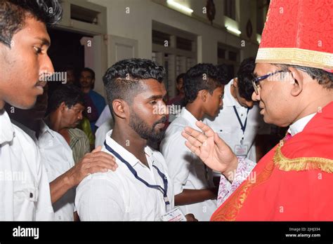 Catholic bishop is giving Confirmation sacrament Stock Photo - Alamy