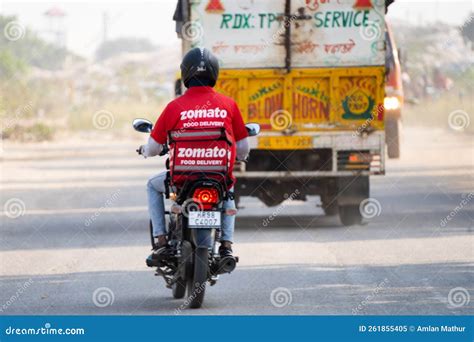 Zomato Bike Rider Delivery Boy Looking At Rider From Swiggy Food Tech ...