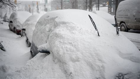 Guess how long it took to dig this car out after blizzard buries it in snow in Long Island City ...