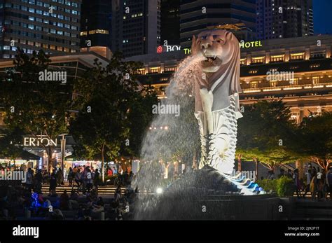 Merlion Park, a iconic statue in Singapore at Night. Merlion is a mythical creature with a lion ...