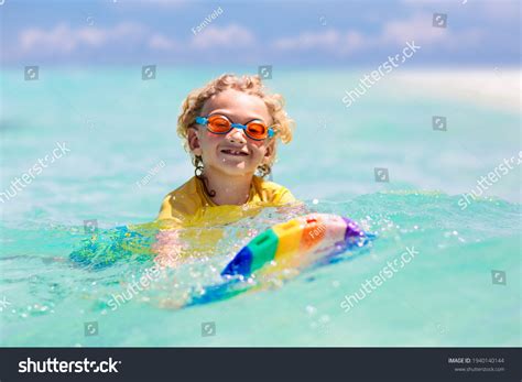 Child Surfing On Tropical Beach Family Stock Photo 1940140144 | Shutterstock