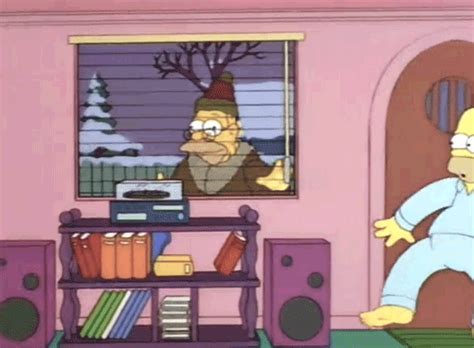 the simpsons character is standing in front of a tv and shelves with books on it