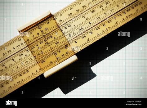 Logarithmic slide rule on piece of graph paper Stock Photo - Alamy