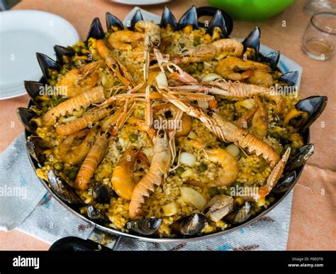 The paella. Spanish typical dish (rice with seafood Stock Photo - Alamy