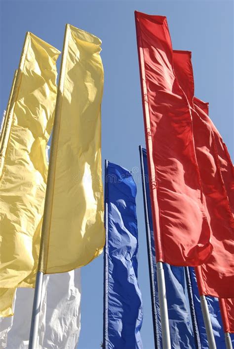 Multicoloured Narrow Long Flags Against Blue Sky Stock Image - Image of ...