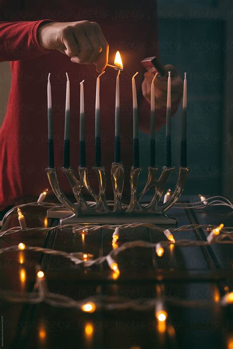 "Hanukkah: Child Lighting Shamash Candle For Hanukkah" by Stocksy ...