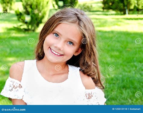 Portrait of Adorable Smiling Little Girl Child Outdoors Stock Photo - Image of green, smile ...