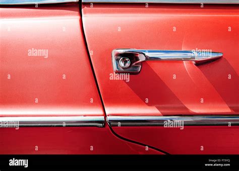 Detail of vintage red car door Stock Photo - Alamy