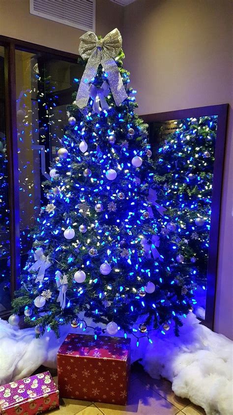 Christmas Tree with blue lights and white ornaments | Purple christmas tree, Blue christmas tree ...