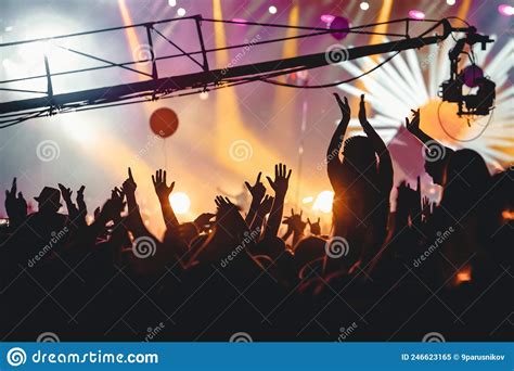 Happy Crowd at a Concert, People with Raised Hands at Summer Music ...