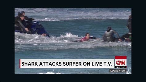 Shark attacks surfer on live tv - CNN Video