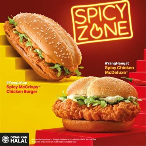 a chicken sandwich with lettuce and mayonnaise next to a spicy zone sign