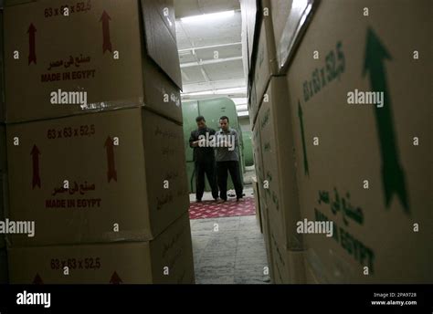 Egyptian workers pray by poxes of their production at the Mahalla al ...