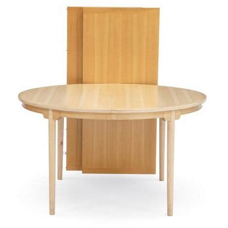 China table A circular cherry wood dining table by Hans J. Wegner on artnet