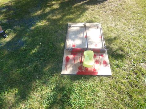 a frisbee golf game is being played on the grass in front of some people