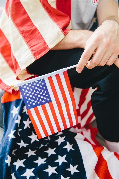 Person Holding An American Flag · Free Stock Photo