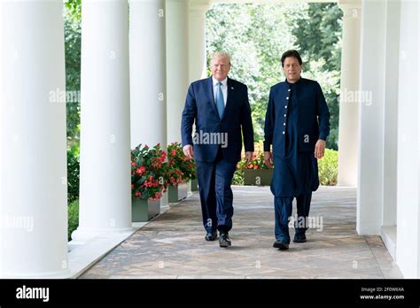 President Donald Trump walks with Prime Minister Imran Khan of the ...