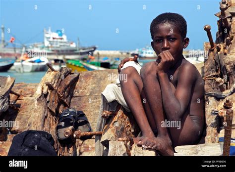 A Somali child whiles away his time at a dock in Bosaso (Boosaaso ...