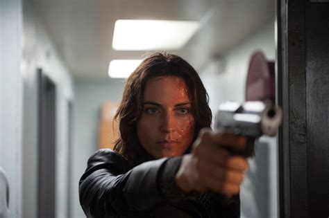 Woman wearing black jacket and pointing gun near doors HD wallpaper ...