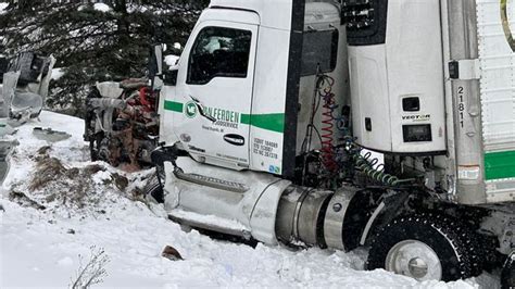 Postal truck driver seriously injured in head-on crash