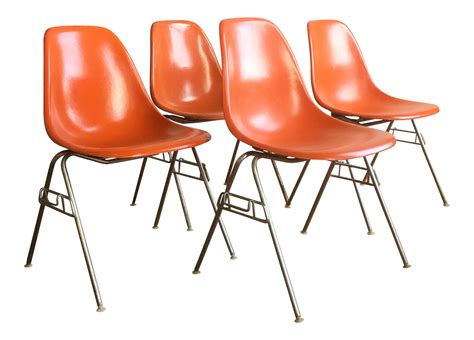 Orange Herman Miller Eames Fiberglass Shell Chairs - Set of 4- ELLEDecor.com Retro Dining Chairs ...