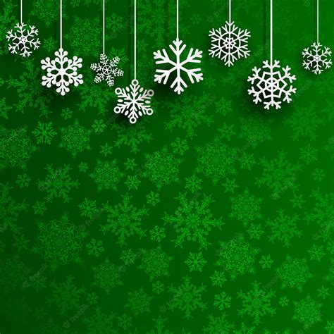 Premium Vector | Christmas background with several hanging snowflakes on green background of ...