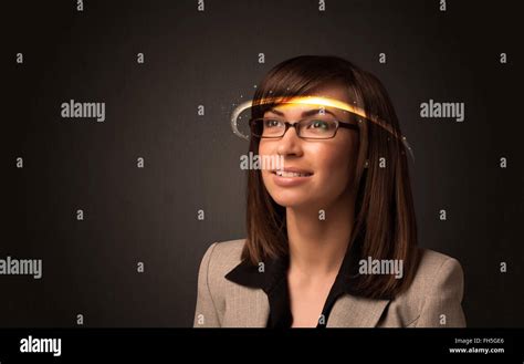 Pretty woman looking with futuristic high tech glasses Stock Photo - Alamy