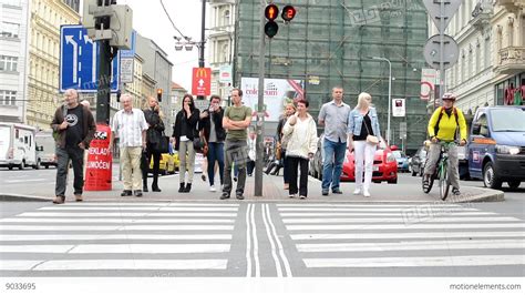 Pedestrians Waiting At Traffic Lights - Busy Urban Street With Cars In The City: Stock video ...