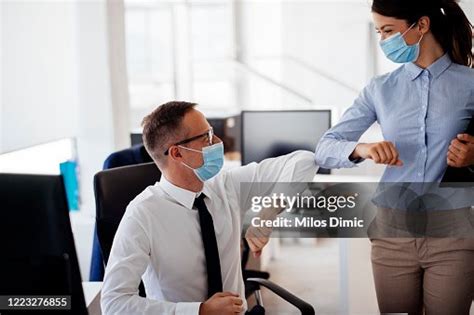 Business People Greeting During Covid19 Pandemic Stock Photo High-Res Stock Photo - Getty Images