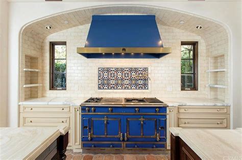 stunning blue stove with mediterranean tile backsplash | Kitchen style, Beautiful kitchens ...