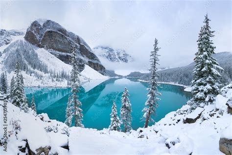 First snow Morning at Moraine Lake in Banff National Park Alberta Canada Snow-covered winter ...