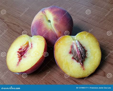 Peach Fruit Halves with Seed, and Whole Peach on Wood Table, Background and Texture Stock Image ...