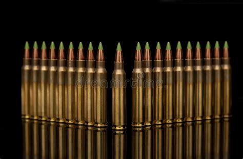 A Group of 5.56 Calibar, Green Tip Bullets Ordered into the Line Stock Photo - Image of bullets ...